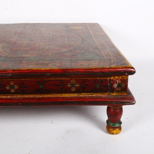 265 - A Middle Eastern style low-centred coffee table with printed design, H15cm, 46cm square