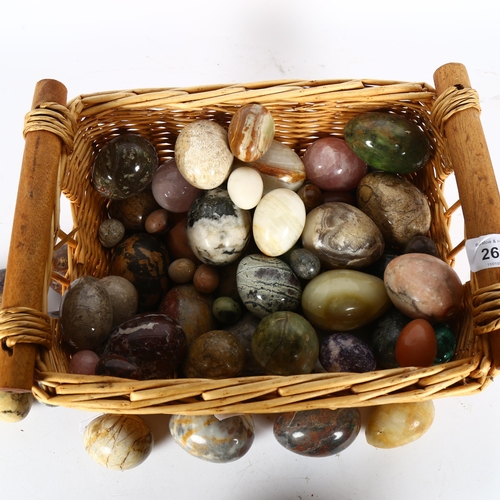 269 - A basket-full of ornamental eggs of various sizes and dimensions, basket H15cm, L30cm, W25cm.