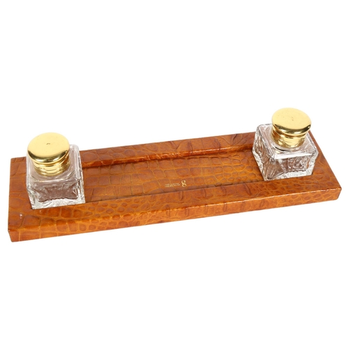 308 - A Vintage crocodile skin desk stand with glass inkwells, length 31cm