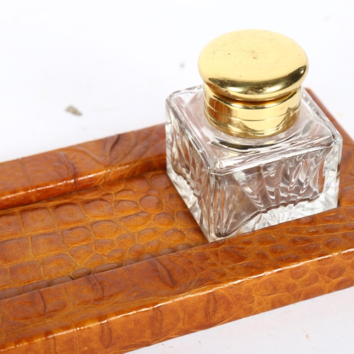 308 - A Vintage crocodile skin desk stand with glass inkwells, length 31cm