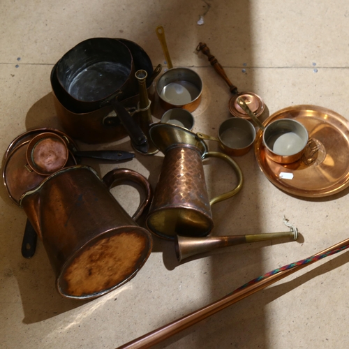 318 - A Vintage copper post horn, L105cm, a quantity of copper and brass kitchenware, including various co... 