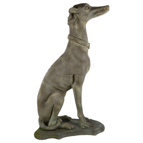 34 - A composite/fibreglass study of a seated Greyhound on shield-shape base, H77cm