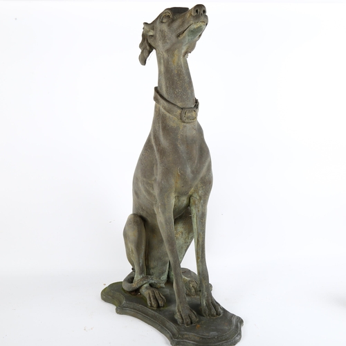 34 - A composite/fibreglass study of a seated Greyhound on shield-shape base, H77cm