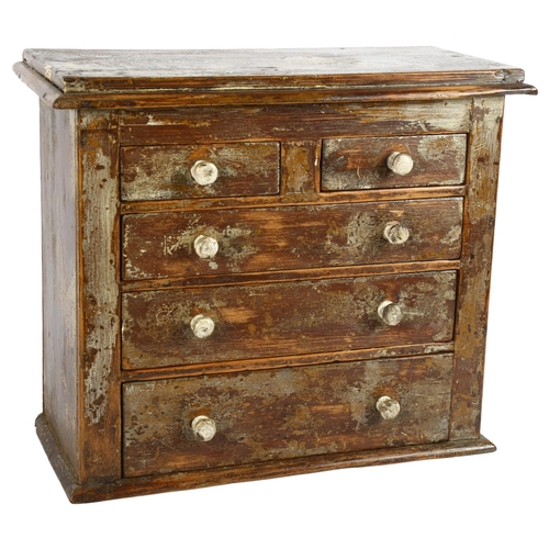 36 - An Antique painted pine table-top chest of 2 short and 3 long drawers, with turned wood handles, W40... 