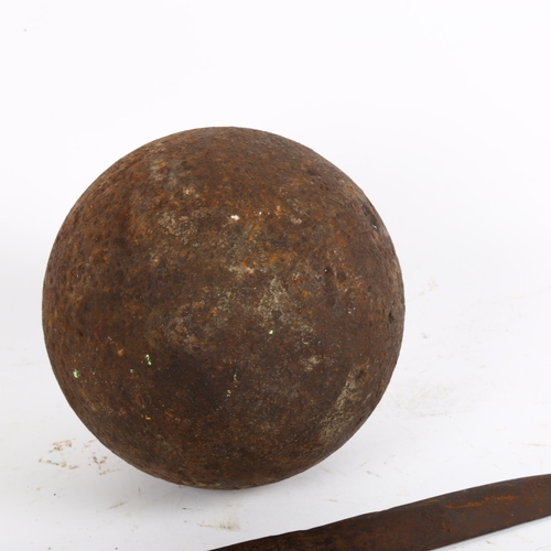 44 - A cast-iron cannon ball, H15cm, an Antique iron sword/short dagger, L62cm, and another, L39cm (3)