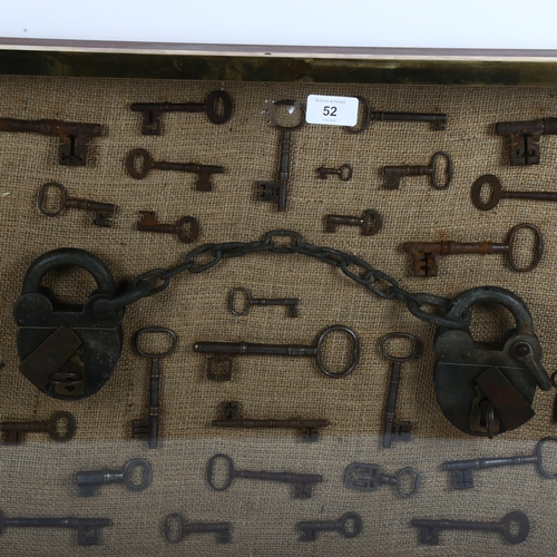 52 - A large wall-hanging display case containing Vintage and Antique skeleton keys, including a set of V... 