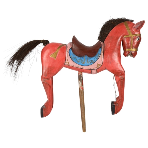 55 - An Oriental carved and painted wooden horse puppet, L36cm