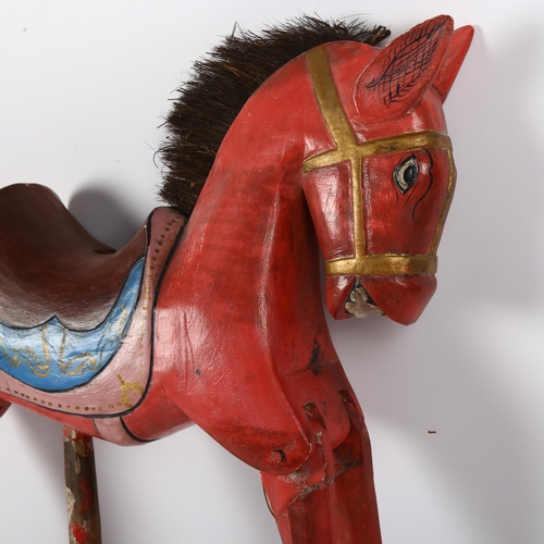 55 - An Oriental carved and painted wooden horse puppet, L36cm