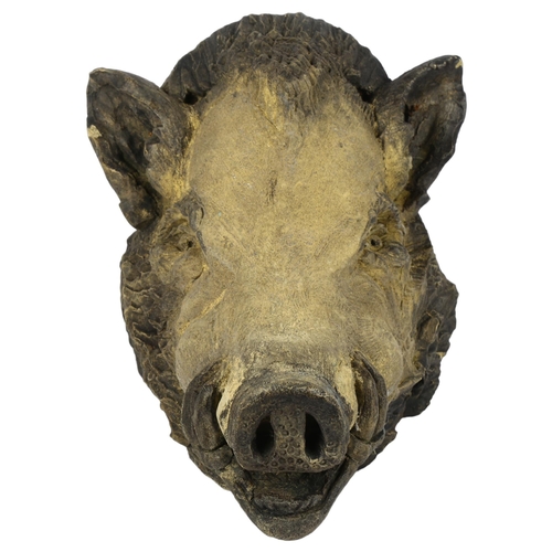 57 - A concrete study of a boar's head, H31cm, D33cm