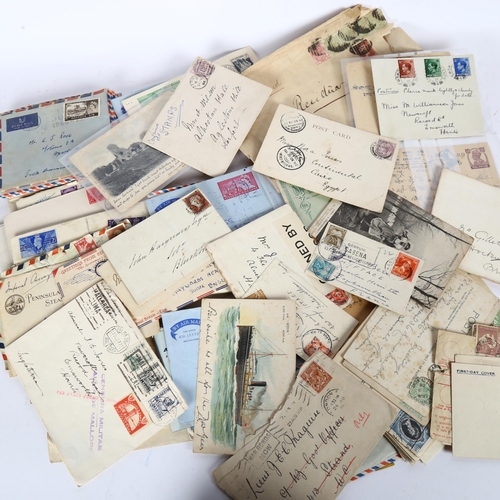 76 - A quantity of stamped envelopes, early 20th century to later