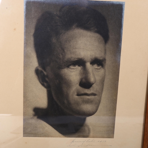 77 - A framed photographic portrait of T E Lawrence, together with a quantity of newspaper cuttings relat... 