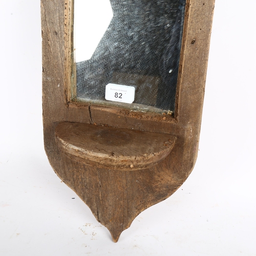 82 - A rustic design shield-shape wall mirror, L80cm