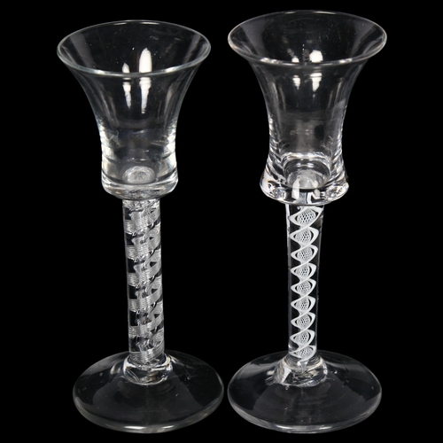 91 - 2 Georgian wine glasses, 1 having a open air twist stem, H15cm, and another with a double opaque twi... 