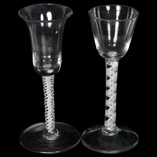 92 - 2 Georgian cordial glasses, both having multiple milk twist spiral columns stems, H15.5cm