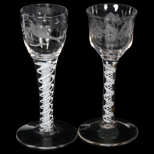 93 - 2 Georgian opaque twist stem wine glasses, both having floral engraved bowls, H15cm and 14cm