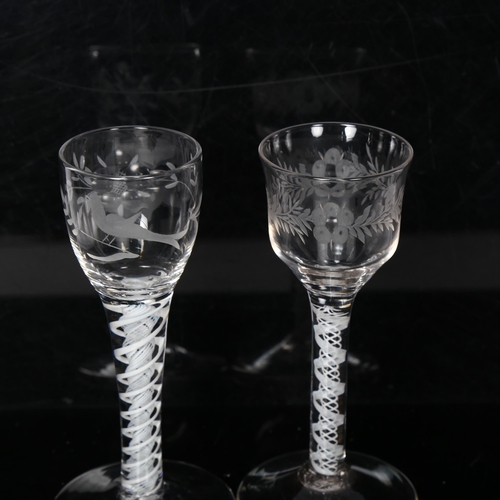 93 - 2 Georgian opaque twist stem wine glasses, both having floral engraved bowls, H15cm and 14cm