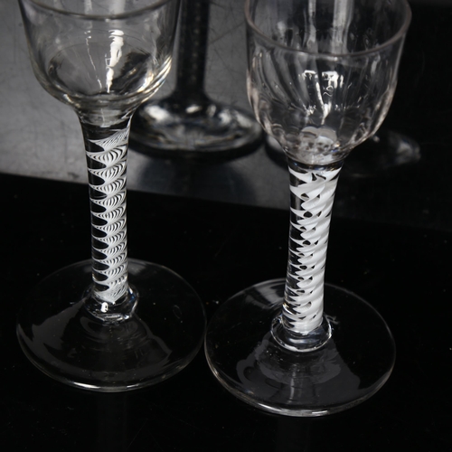 96 - 2 Georgian cordial glasses, 1 having a fluted bowl on a triple milk twist stem, H13.5cm, the other h... 