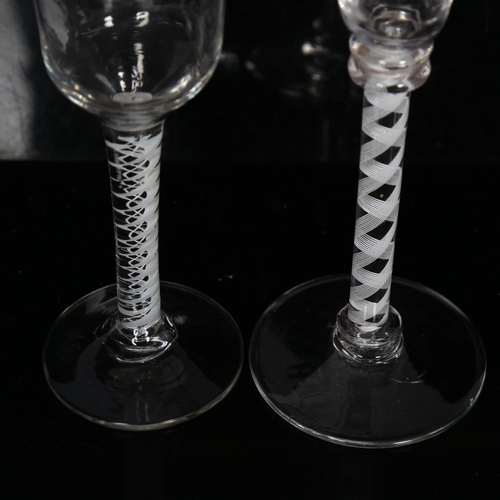 97 - 2 Georgian wine/liqueur glasses, 1 having a ribbon twist stem, H15cm, the other having a flared bowl... 