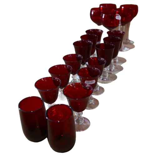 353 - A set of 12 ruby glass goblets on clear baluster stems, Hock glasses, 16.5cm etc