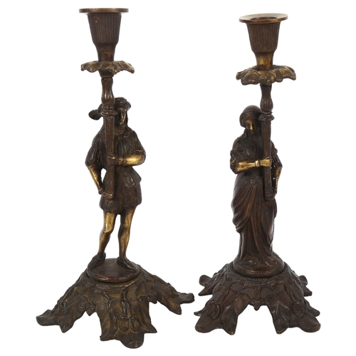 359 - A pair of patinated cast-brass candlesticks with figure supports, 28cm