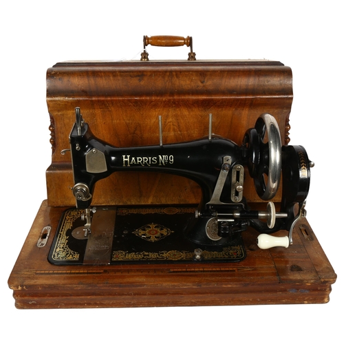 386 - A Vintage Harris no. 9 sewing machine, in marquetry inlaid case with key