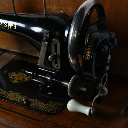 386 - A Vintage Harris no. 9 sewing machine, in marquetry inlaid case with key