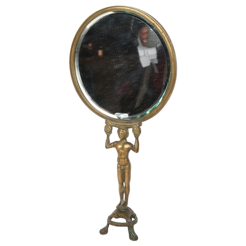 412 - A circular brass bevel-edge mirror with figure support, H40cm