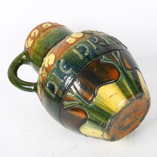 417 - Antique European incised and glazed ale jug, inscribed Die Drinkt Die Leeft, A/F, 30cm