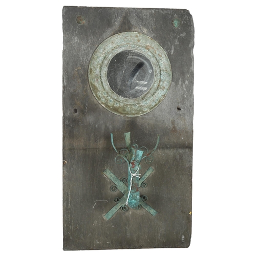 467 - A slate-backed wall mirror with sconce, height 56cm