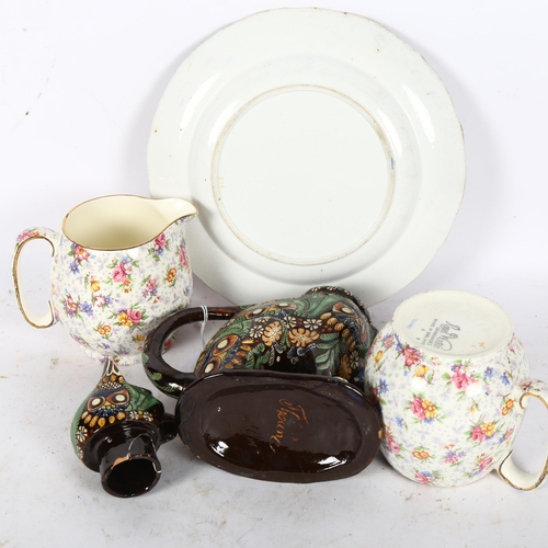 469 - A pair of Royal Winton chintz jugs, a Thune cat figure teapot, 20cm (A/F), and a Victorian plate