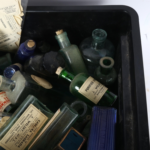 478 - A collection of medicine bottles with labels, ink bottles etc, and a folder containing chemist's bot... 