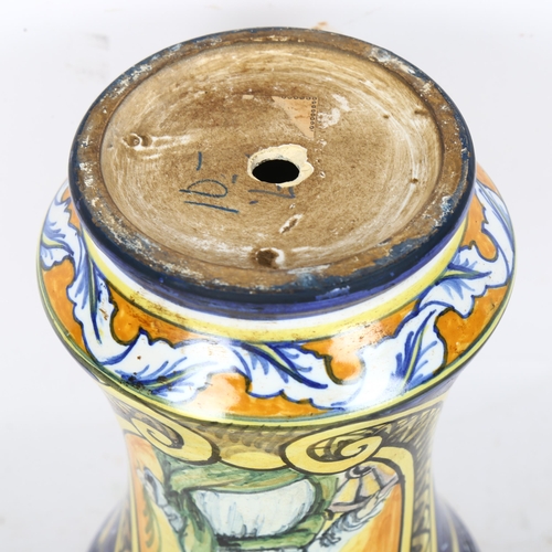 490 - An Antique Maiolica vase, decorated with a picture of a lady and various wild fruits, a hole has bee... 