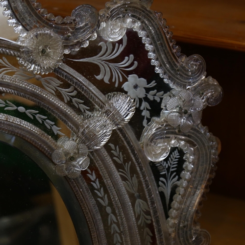 546 - A Venetian wall mirror with elaborate moulded flowerhead mounts and etched panels, overall height 11... 