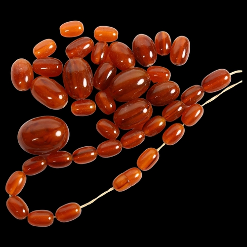 854 - *Description change* An amber coloured bakelite bead necklace (for re-stringing), 71g, largest bead ... 