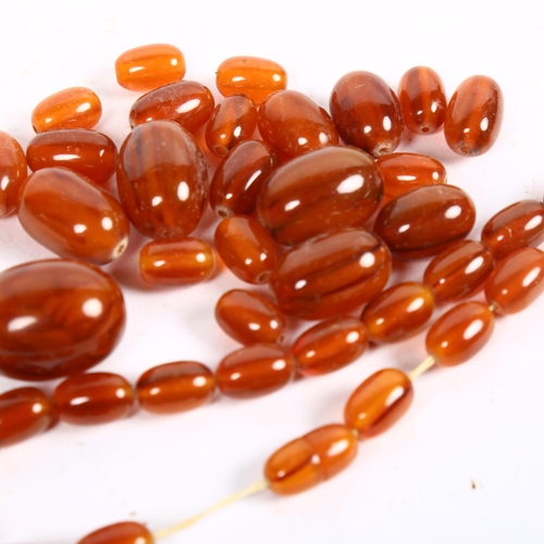 854 - *Description change* An amber coloured bakelite bead necklace (for re-stringing), 71g, largest bead ... 