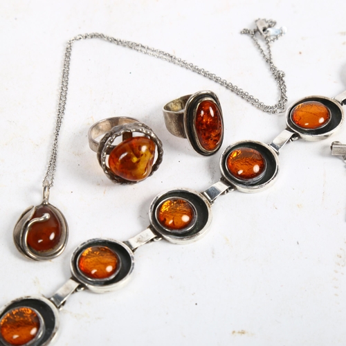 857 - Various Danish silver and amber jewellery, to include 2 rings, a bracelet, a necklace, a Georg Jense... 