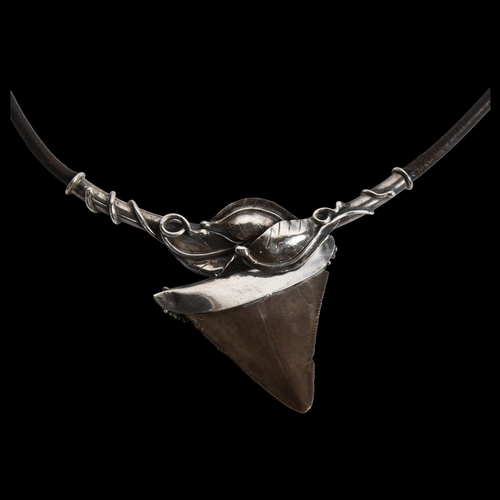 859 - A Scandinavian shark's tooth pendant necklace, white metal mounts