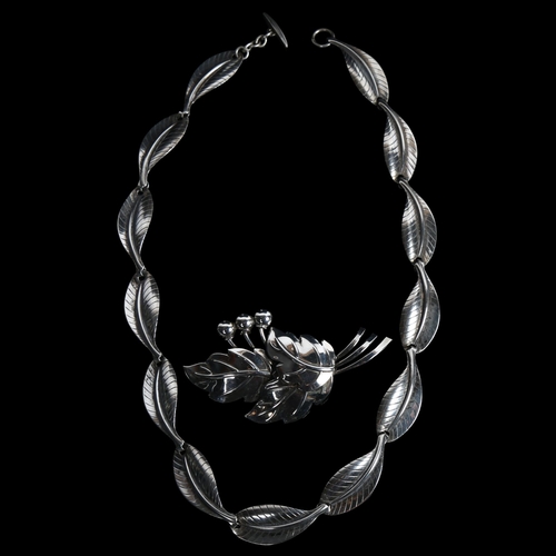 862 - HERMANN SIERSBOL - a Danish sterling silver modernist leaf line necklace, and similar brooch