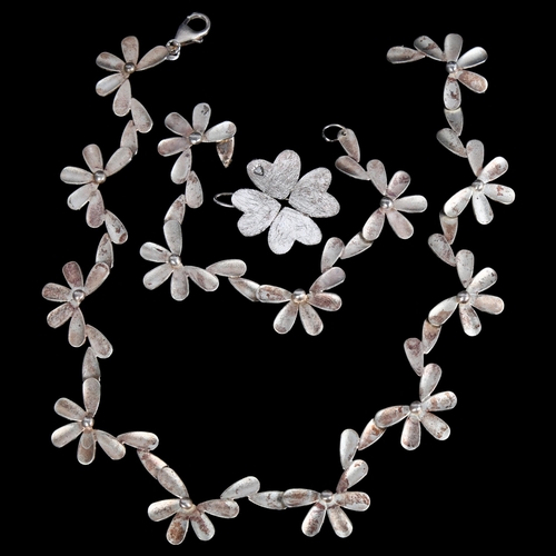 869 - A flower design sterling silver necklace and matching bracelet, and a similar brooch by Kravz & Zieg... 