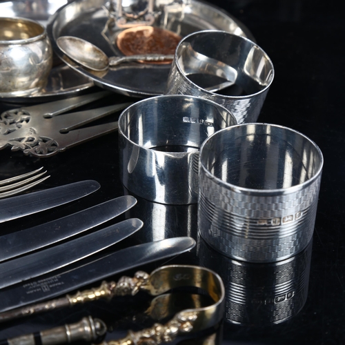 875 - A group of silver items, to include napkin rings, small circular dish, silver-handled knives etc, 7.... 