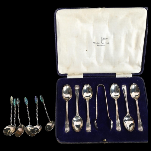 877 - A cased set of 6 silver teaspoons with matching tongs, by Walker & Hall, and a set of 6 unmarked sil... 