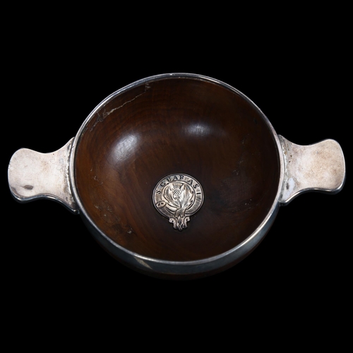 885 - A Scottish quaich of turned beech form, unmarked silver mounts with cescral garter motif and thistle... 