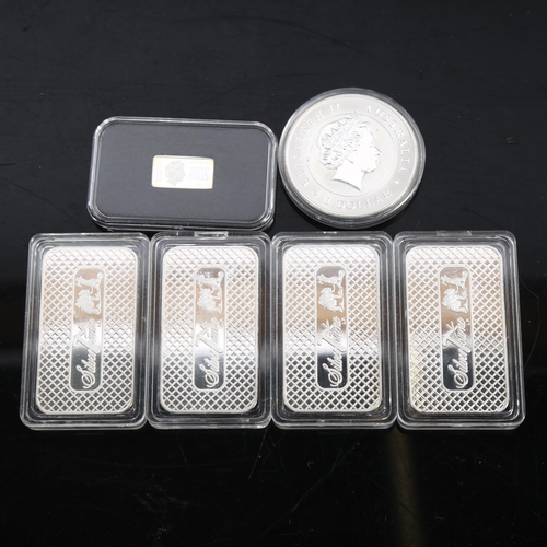 889 - 4 x 1oz fine silver ingots, an Elizabeth II Australian silver dollar, and a commemorative silver 50 ... 