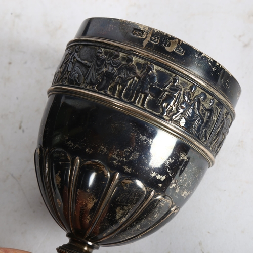 903 - A large Victorian silver chalice, fluted bowl with an embossed band of figures, height 19.5cm, hallm... 