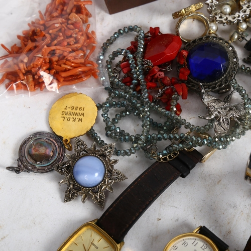 906 - 2 tins of mixed Vintage and other costume jewellery and wristwatches, including white quartz, beads,... 