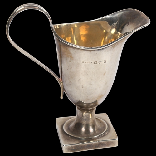 910 - An Edward VII silver helmet-shaped cream jug, hallmarks for Birmingham 1906, 2.2oz