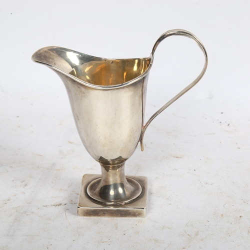 910 - An Edward VII silver helmet-shaped cream jug, hallmarks for Birmingham 1906, 2.2oz