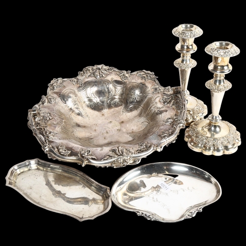 824 - A Victorian engraved and embossed swing-handled silver plated fruit basket, a pair of silver plate o... 