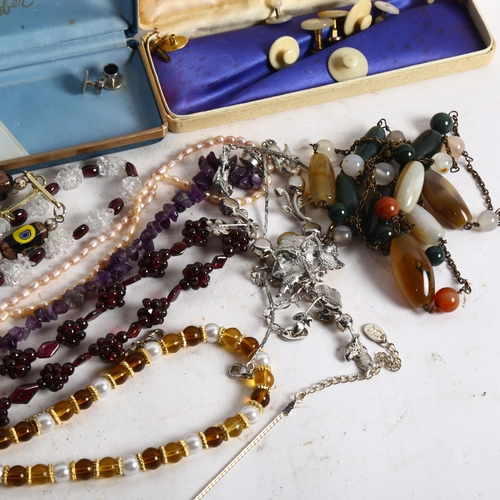 831 - A group of modern costume jewellery, to include an amethyst necklace, bead necklaces, 2-colour pearl... 