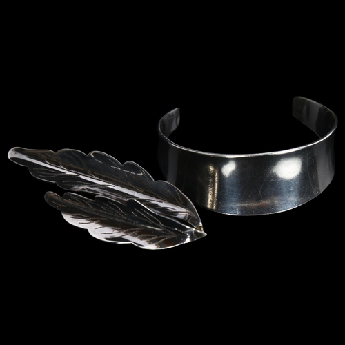 839 - ULRICH - a modernist Danish sterling silver torque bangle, and a sterling silver leaf design brooch ... 